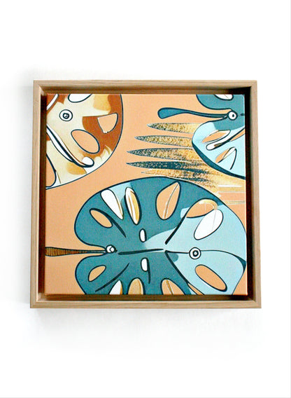 Monstera Canvas Tavla Nordisk med Ekram 30×30 - stiliserade monstera-blad i turkos, skogsgrön och ockragul, inramad modert print